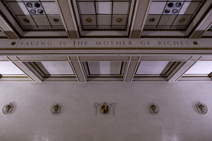 Banking Hall ceiling on which the words 'Saving is the mother of riches' is inscribed