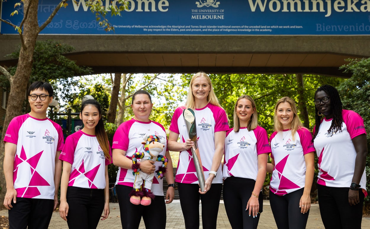 A group of batonbearers posing with the Queen's baton at the University of Melbourne