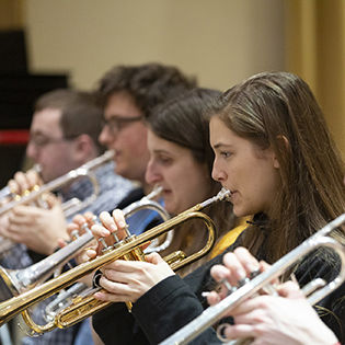 Students playing trumpets