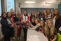 Group of female students attending a School of Chemistry STEM day event