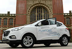 A hydrogen fuel cell car parked outside Aston Webb