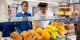 teenagers choosing healthy snacks in canteen