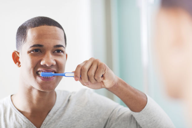 Image of person brushing their teeth