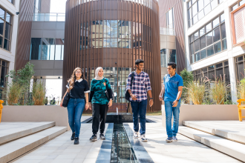 group-of-students-walking-through-courtyard-cropped-330x220