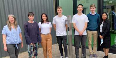 BEI interns gather outside the Birmingham Energy Innovation Centre with Dr Emily Prestwood standing on the far left