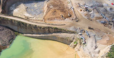 Aerial photo of industrial extraction activity by a coastlne