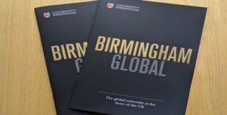 Two Birmingham Global brochures on a table