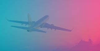 Plane taking off with a blue and pink background