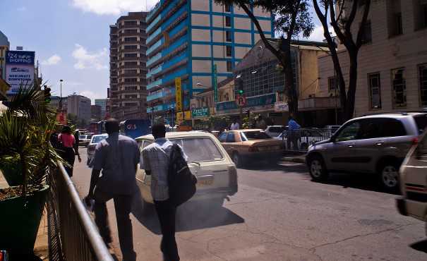 Heavy traffic in Nairobi showing emissions coming from a car
