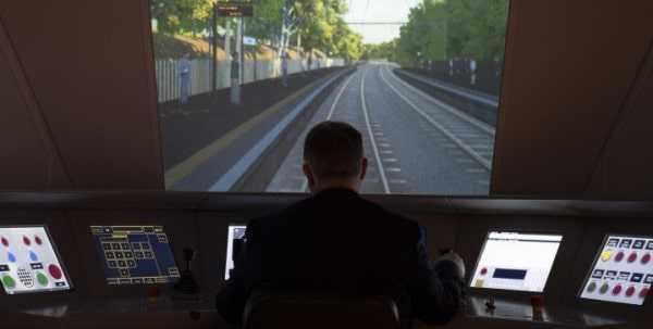 Professor Clive Roberts sat at rail simulator