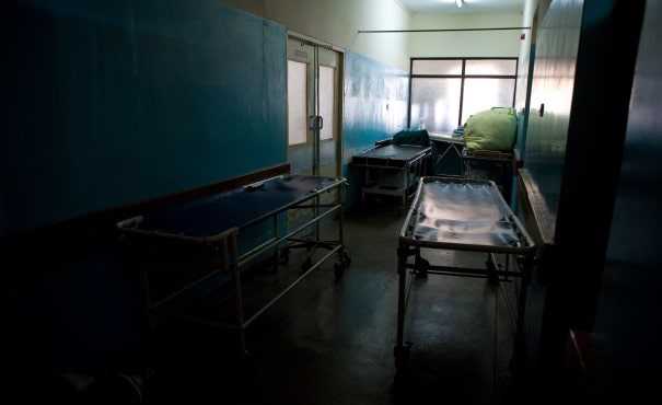 Hospital corridor full with empty beds