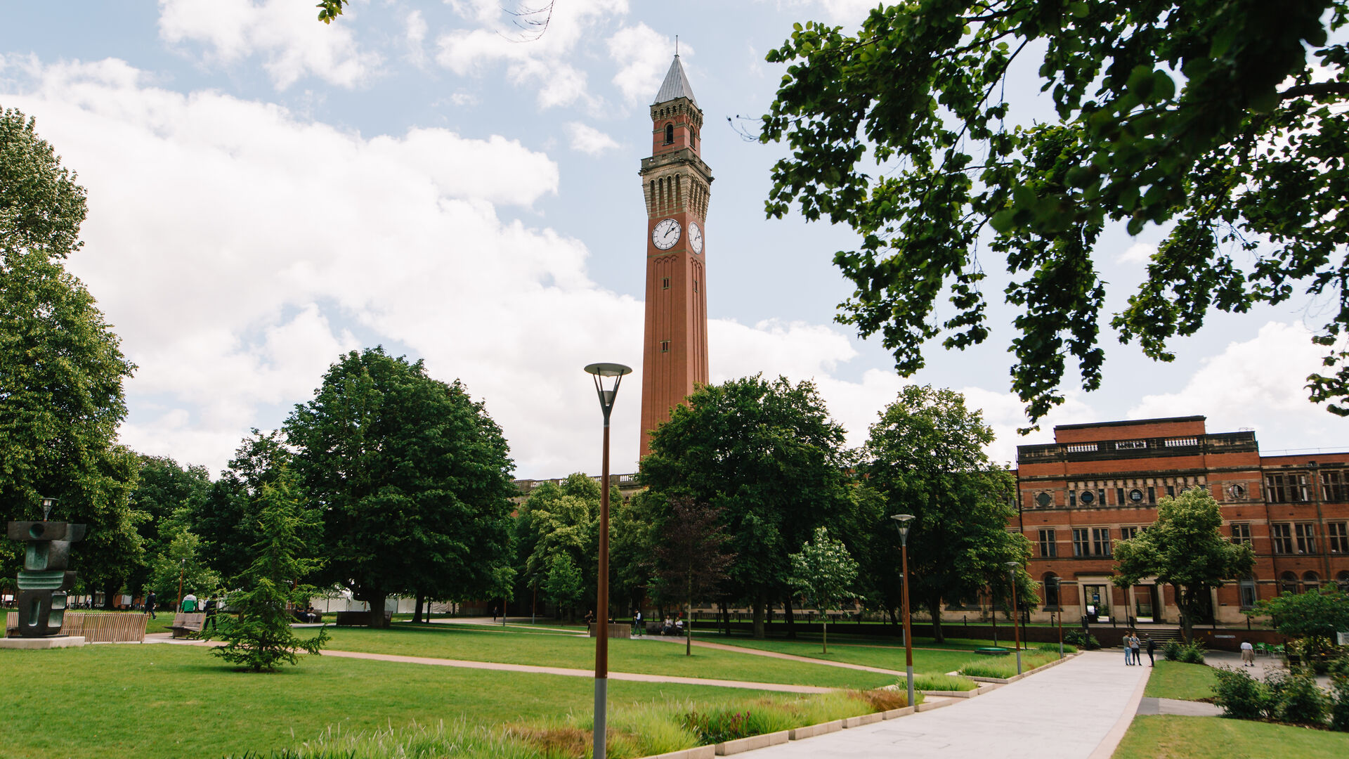 Campus with Old Joe clocktower against a blue sky backdrop