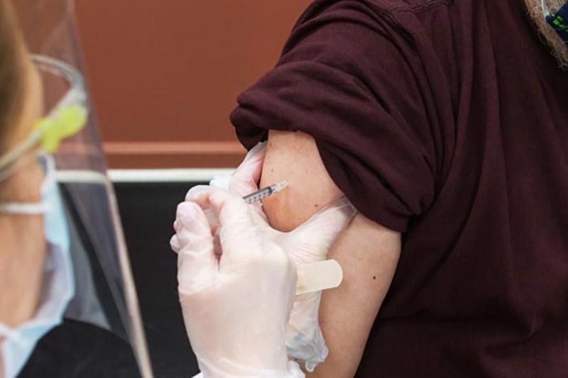 close up of arm being vaccinated
