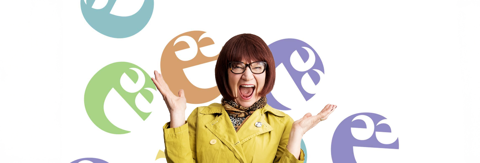 Barbara Nice, a lady with red hair, Tortoiseshell glasses and a huge smile