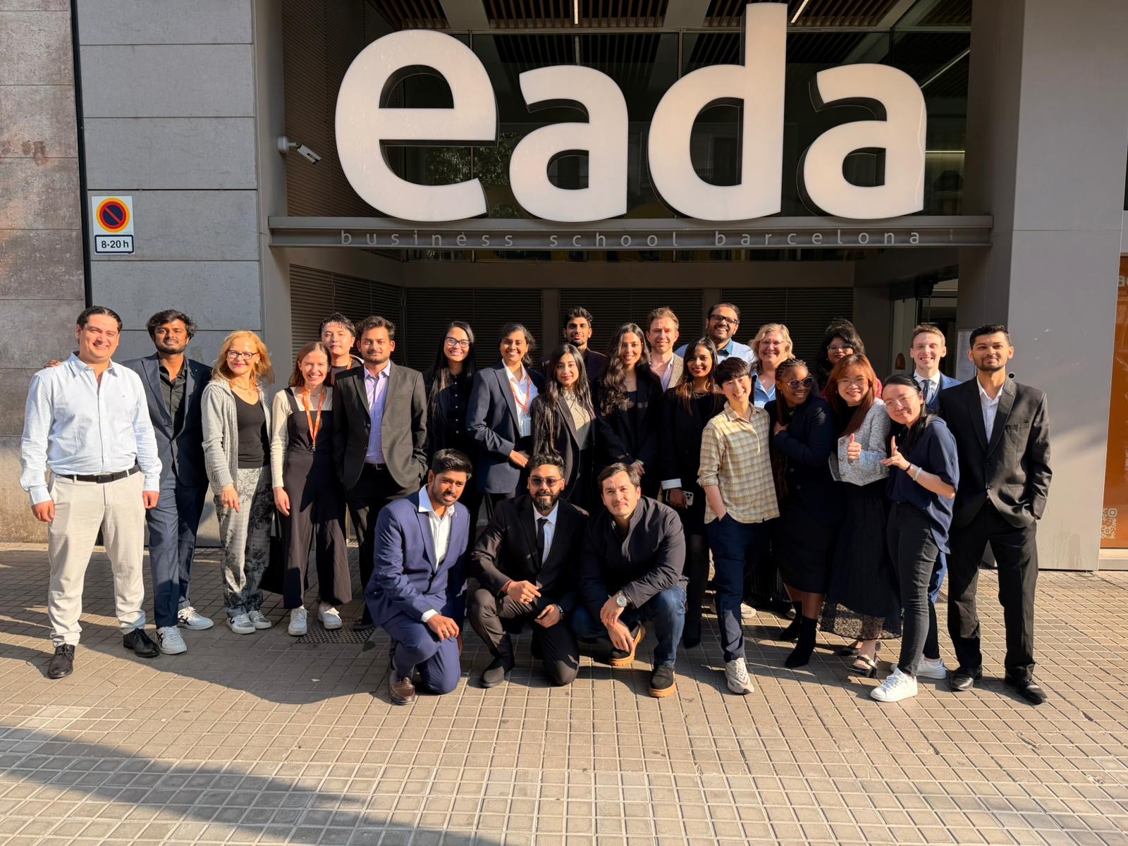 A group of approximately 20 Birmingham MBA students together outside EADA Business School in Barcelona.