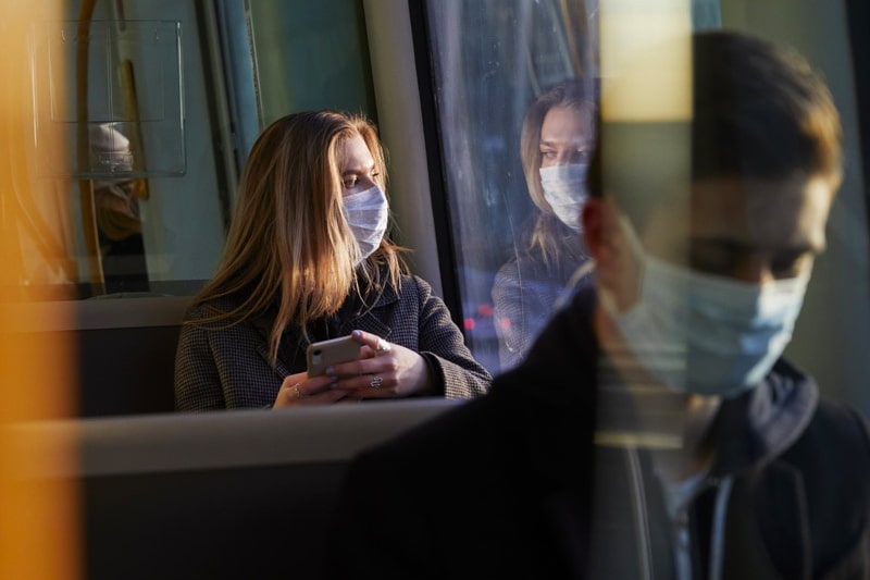 Bus passengers wearing face masks 