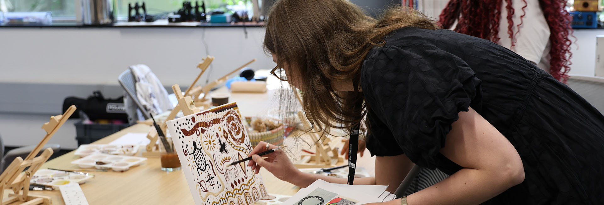 Person painting in a workshop