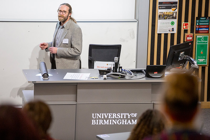 Lloyd Jenkins presenting to a lecture room