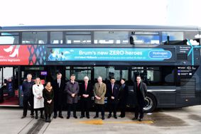 Representatives from the CCC, Tyseley Energy Park, Birmingham City Council and National Express stand in front of a hydrogen bus