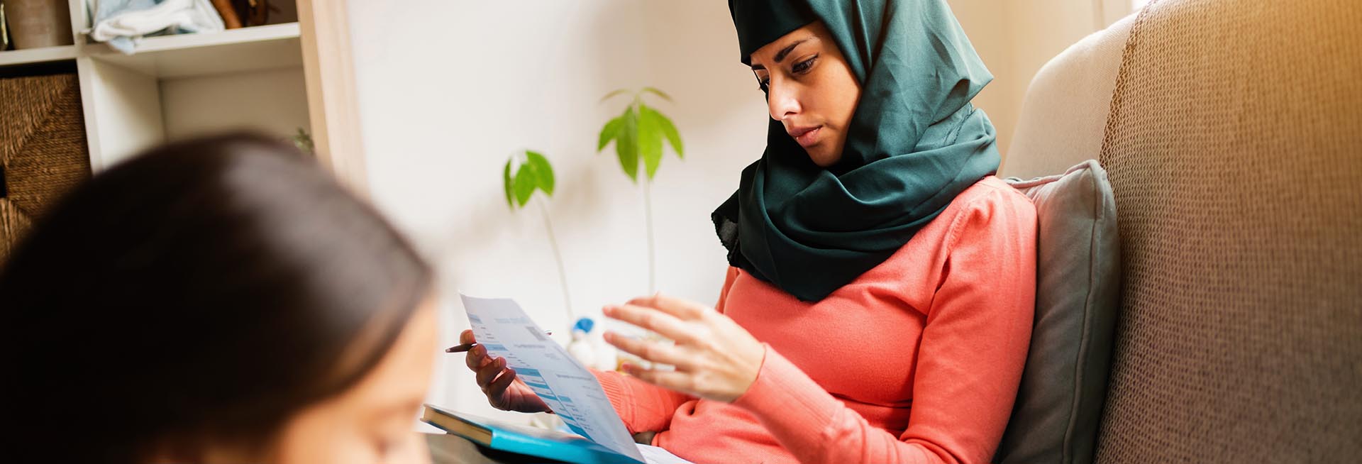 Woman looking at an energy bill