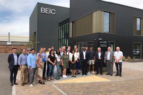 The group of SME's from the second cohort of the Climate Innovation Platform stand outside the Birmingham Energy Innovation Centre 