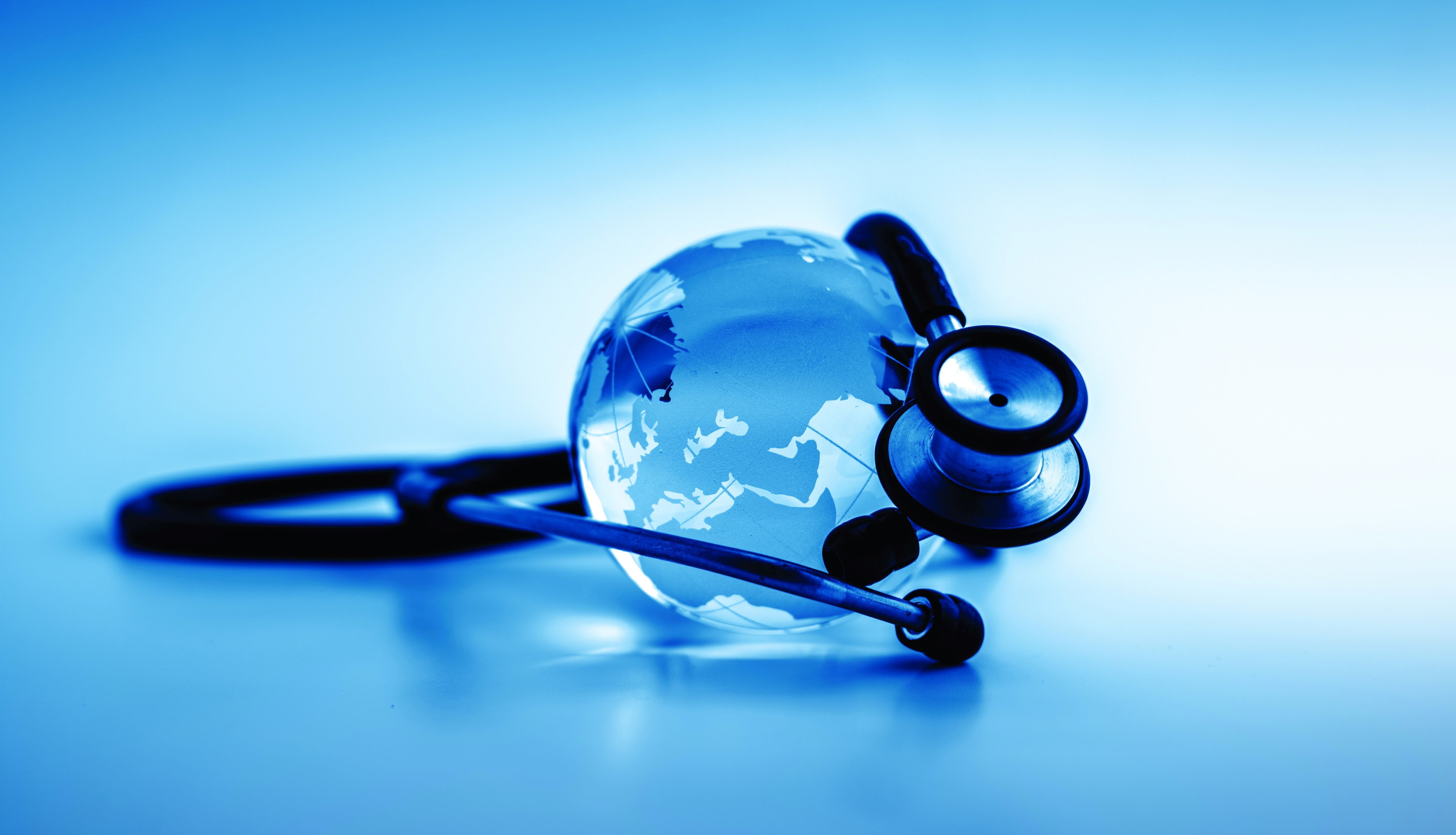 Stethoscope wrapped around a world
