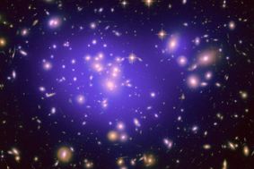 Image from NASA's Hubble Space Telescope showing a galaxy cluster surrounded by dark matter