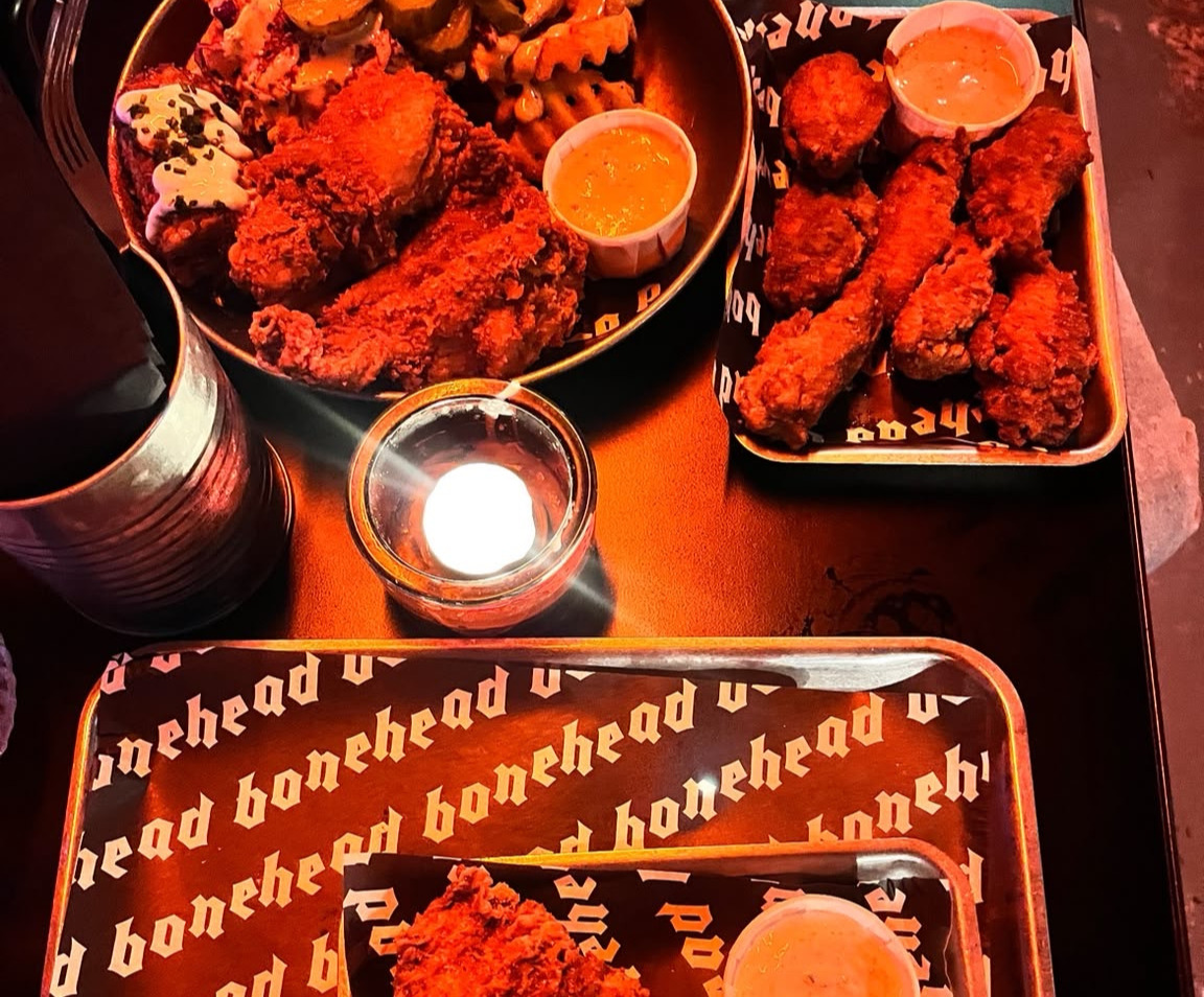 An image of fried food on a basket at a restaurant