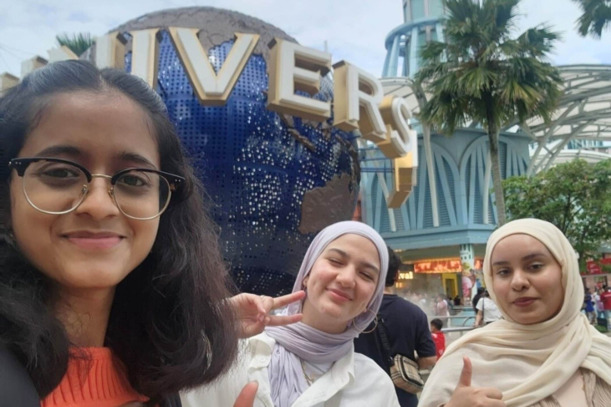 A group of girls posing for a picture at Universal Studios.