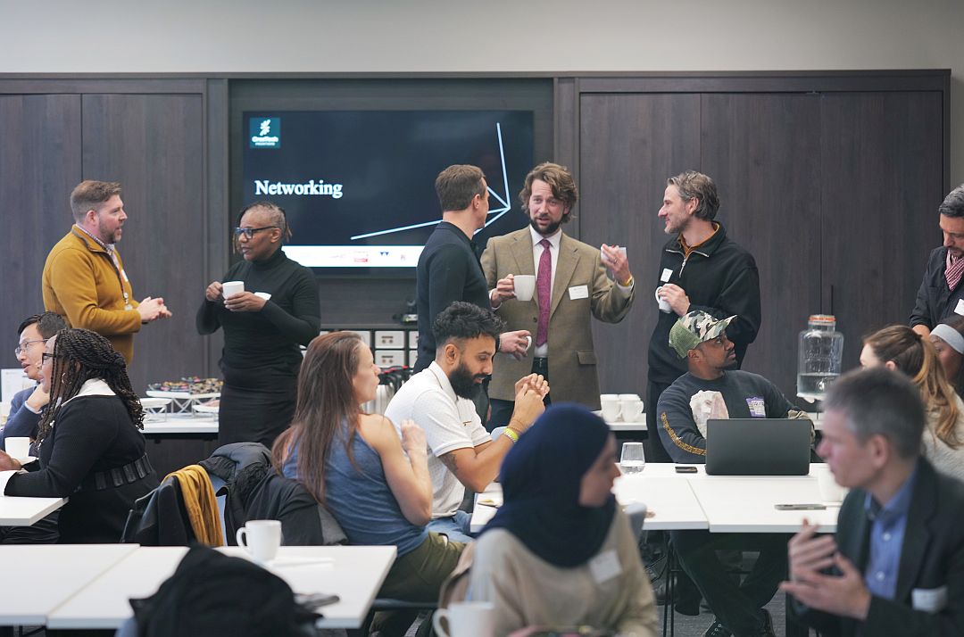 People attending a networking event. They are chatting amonst themselves