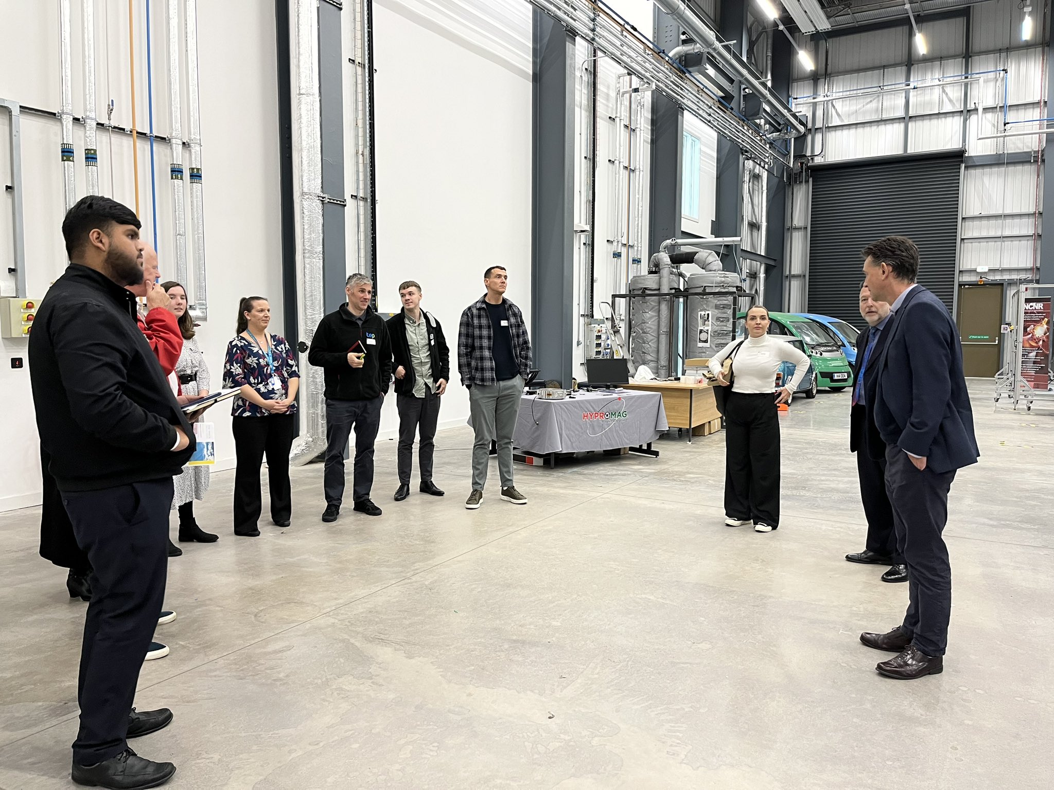 Attendees gather around listening to Martin Freer on a tour of the BEIC