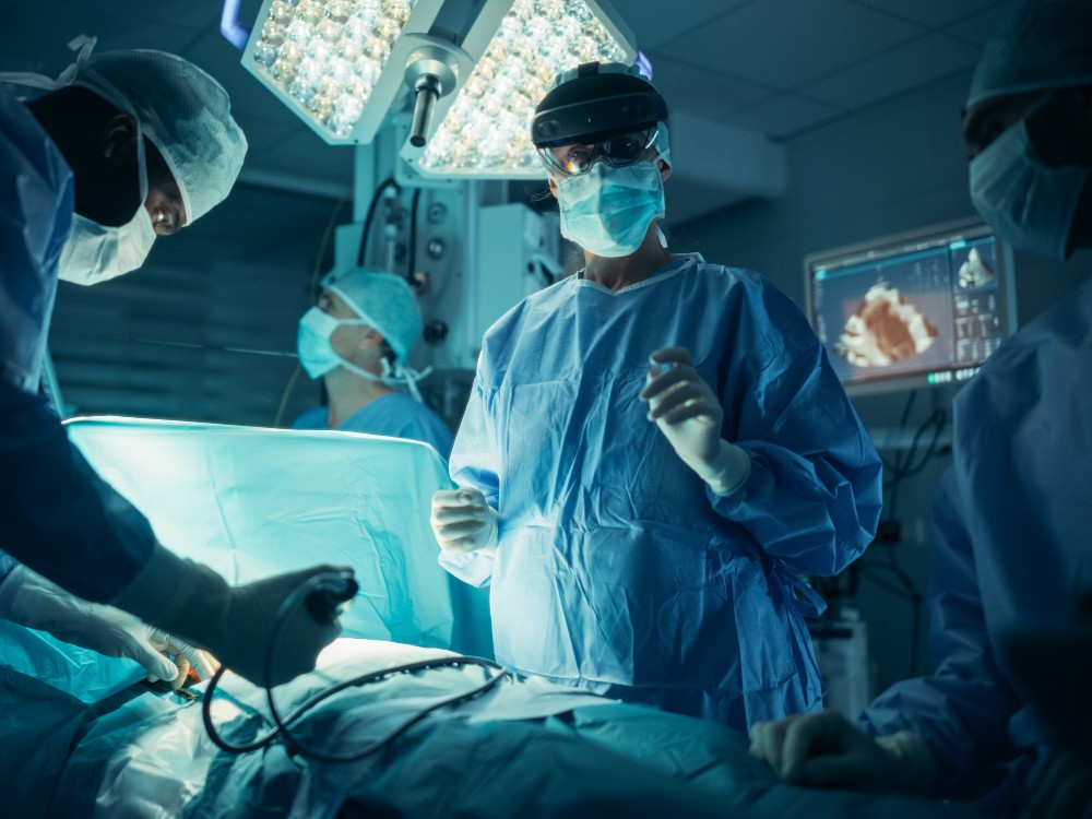 An operating theatre with gowned clinicians