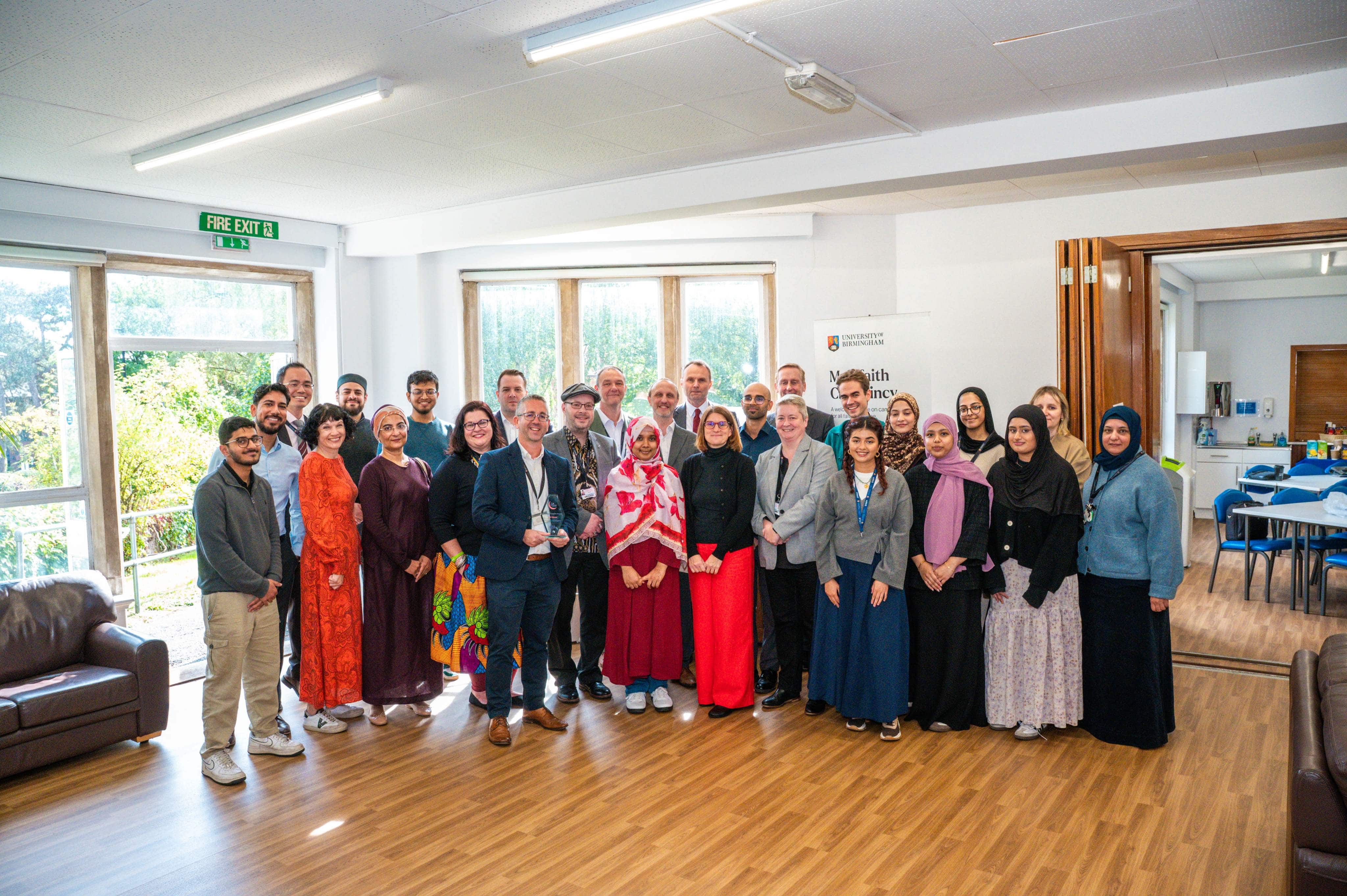 A large group of men and women with different ethnicities 