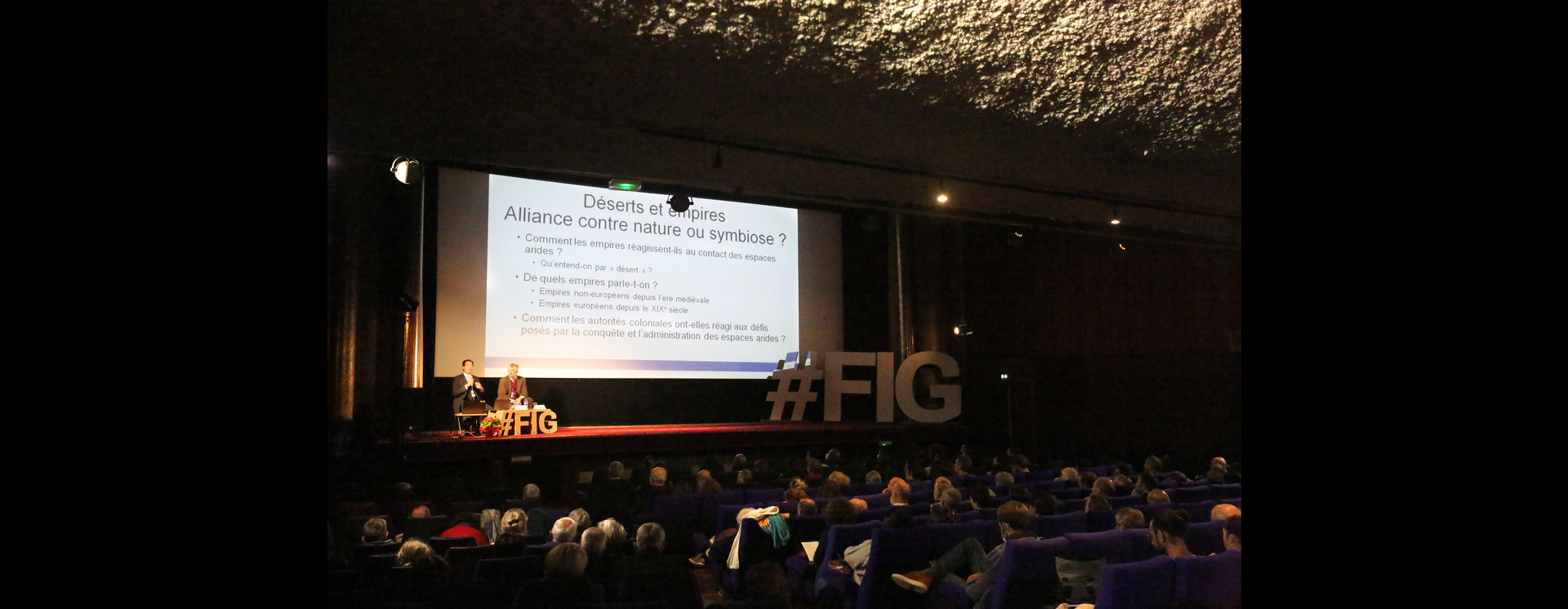 Dr Berny Sèbe presenting a guest lecture at the Cinéma Empire.