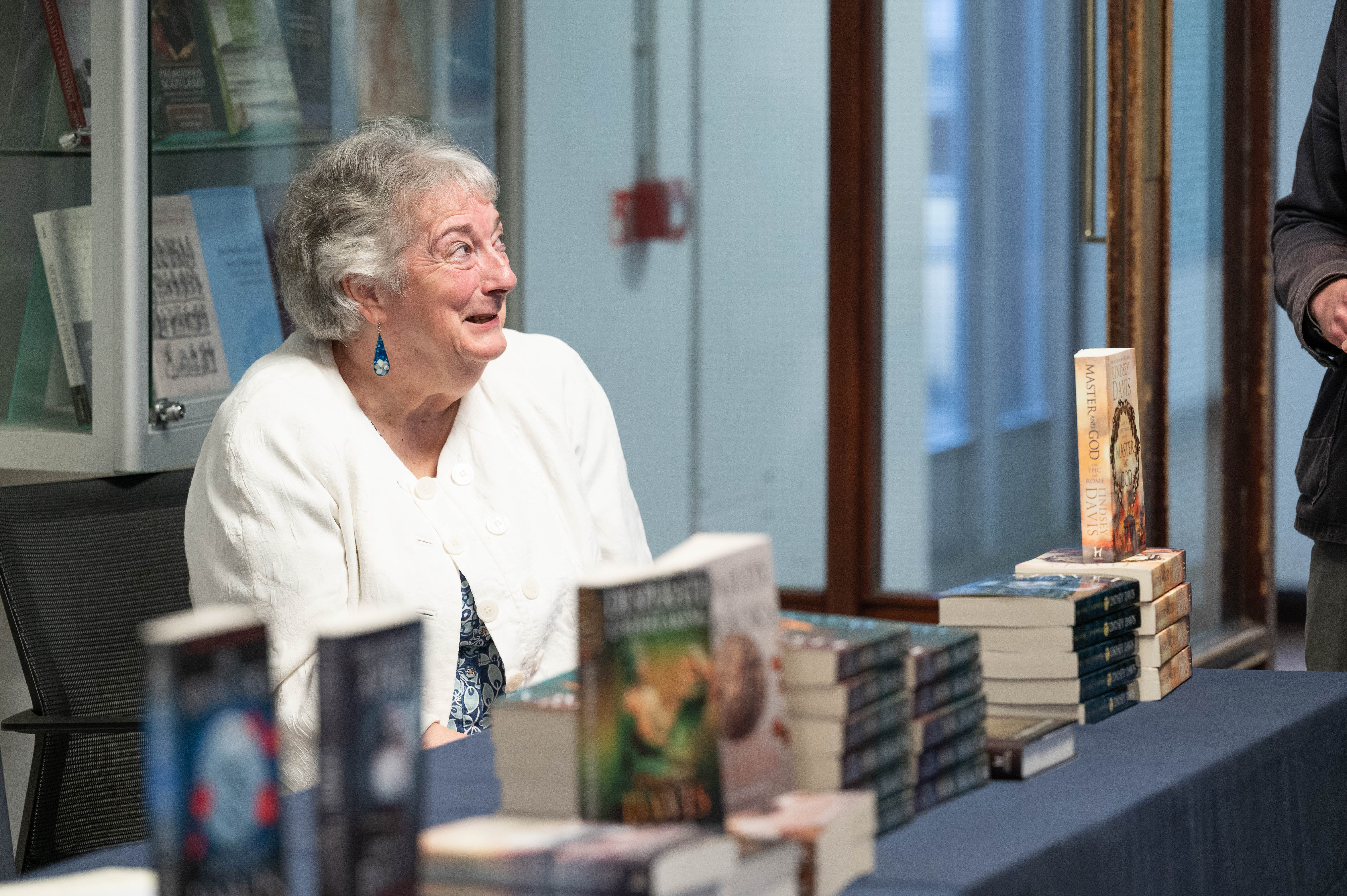 Lindsey Davis meeting guests at the Lecture book signing 