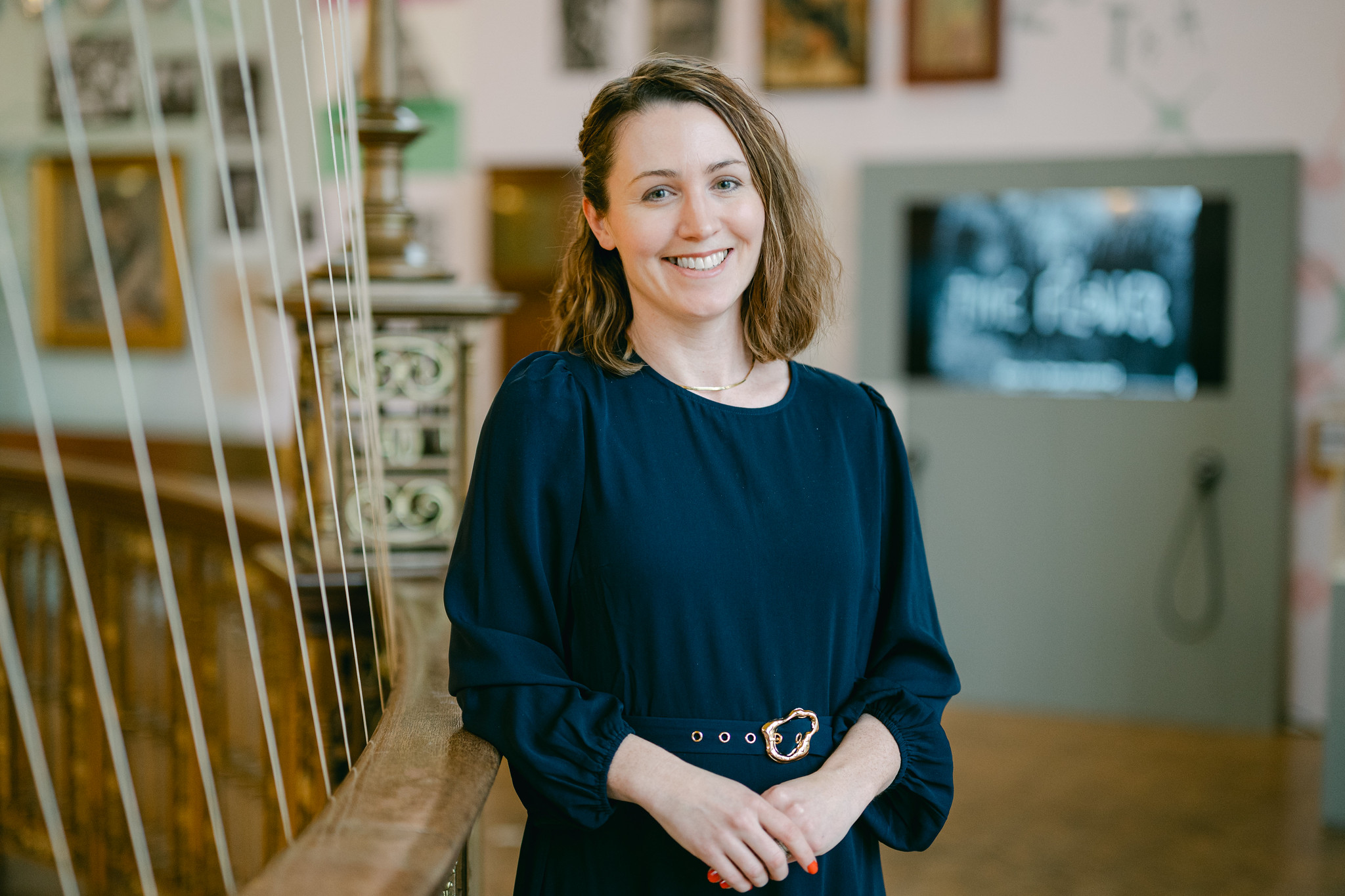 Professor Linden Thomas poses in the University of Birmingham's Aston Webb rotunda.