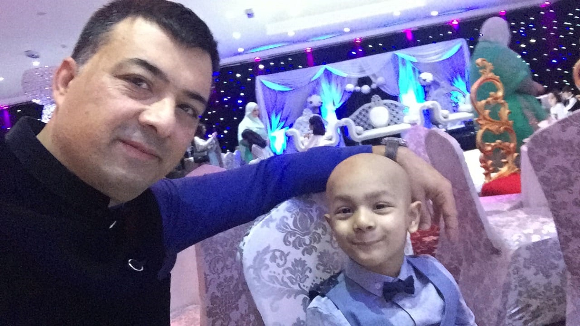 Neuroblastoma patient Abdullah who took part in the BEACON trial pictured alongside his father at a wedding 