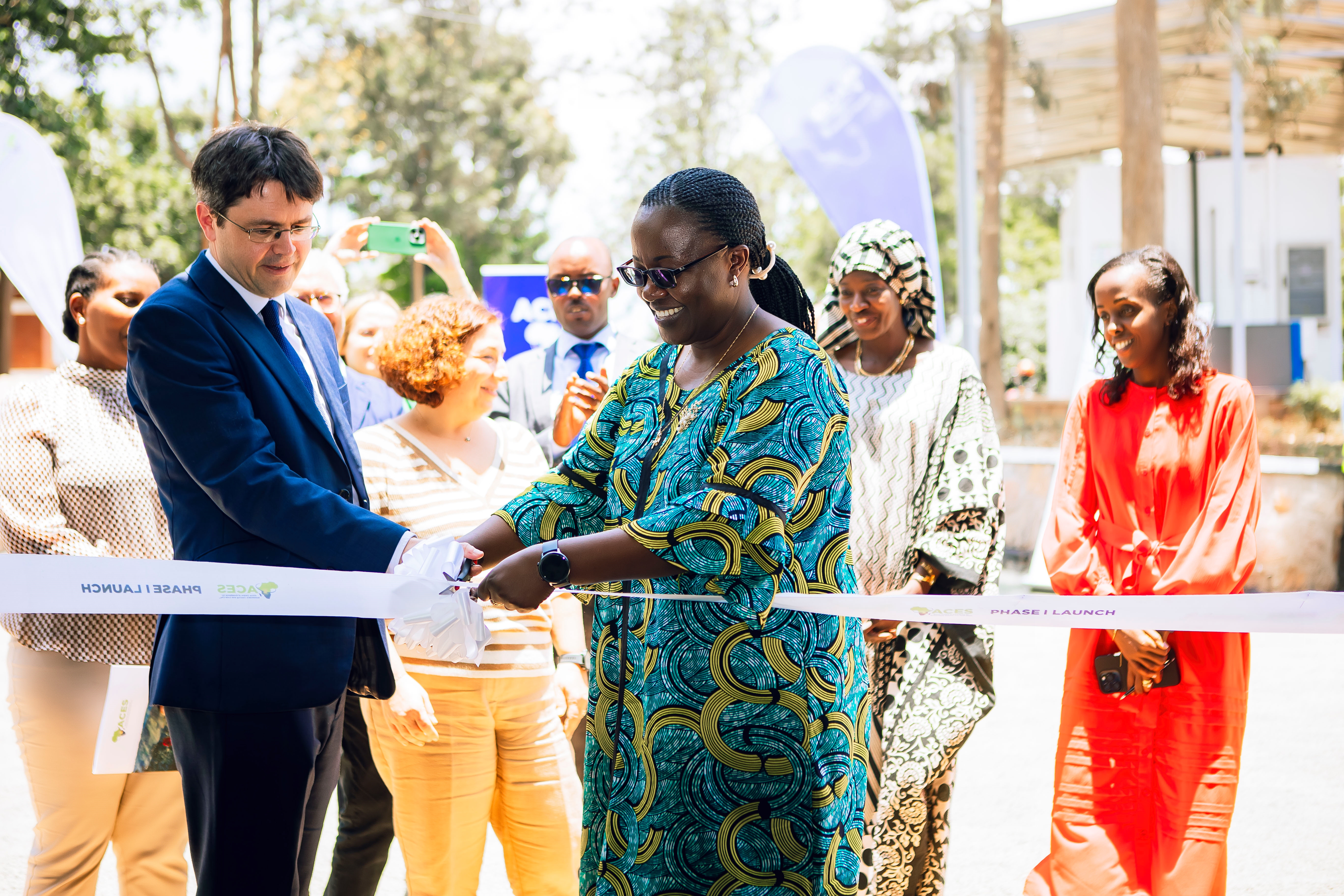 Dr. Jeanne d'Arc Mujawamariya and David Hill cut the ribbon to open ACES