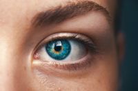 Close-up of human blue eye on female