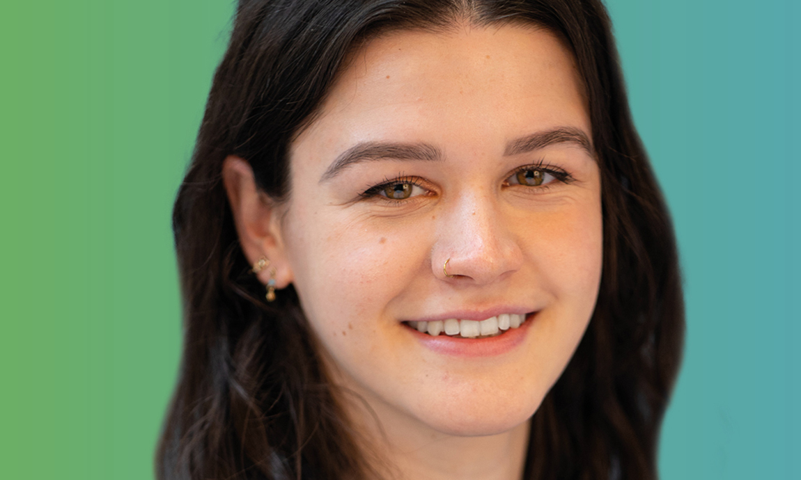 Close up of young woman smiling to camera
