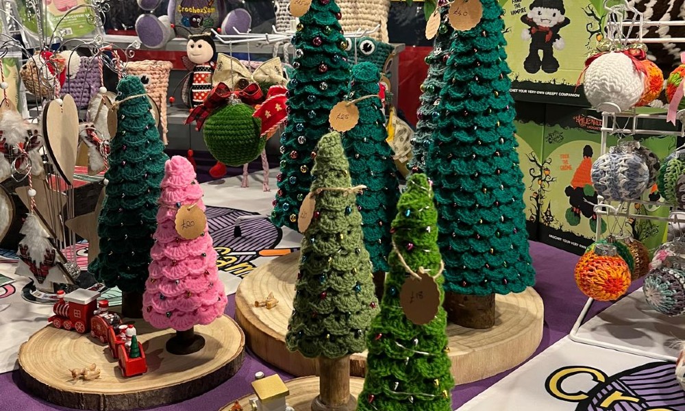 Crocheted Christmas trees and other decorations on a market stall