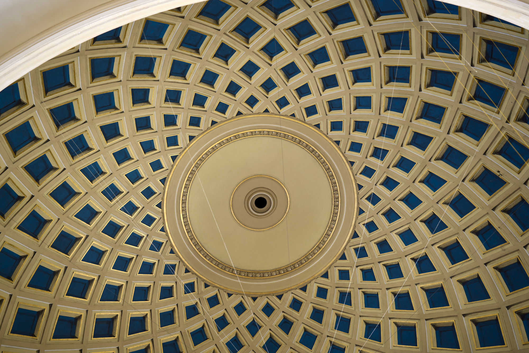 The blue and gold lattice ceiling of the whispering gallery in the University of Birmingham's Aston Webb building