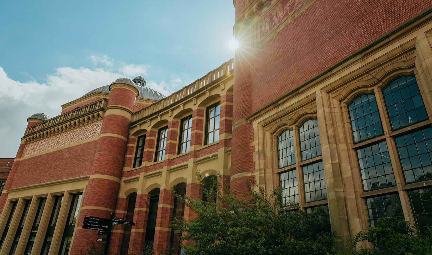 View of the Aston Webb building with the sun cresting behind it