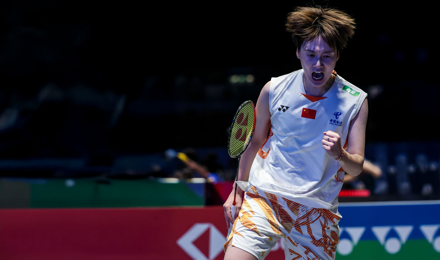 Badminton player, Chen Yu Fei, celebrating after winning a point during a match