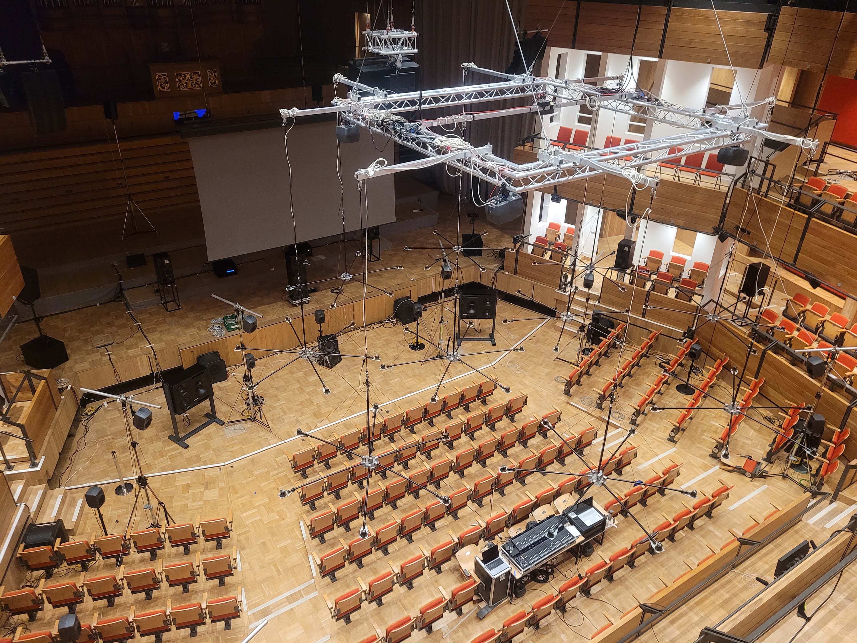 Overhead shot of the concert hall with the electro-acoustic sound system and speakers in place, but without any people in shot