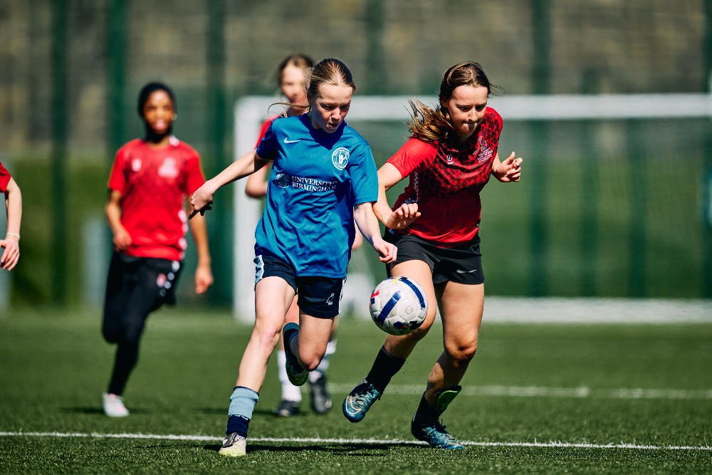 Group of girls playing football