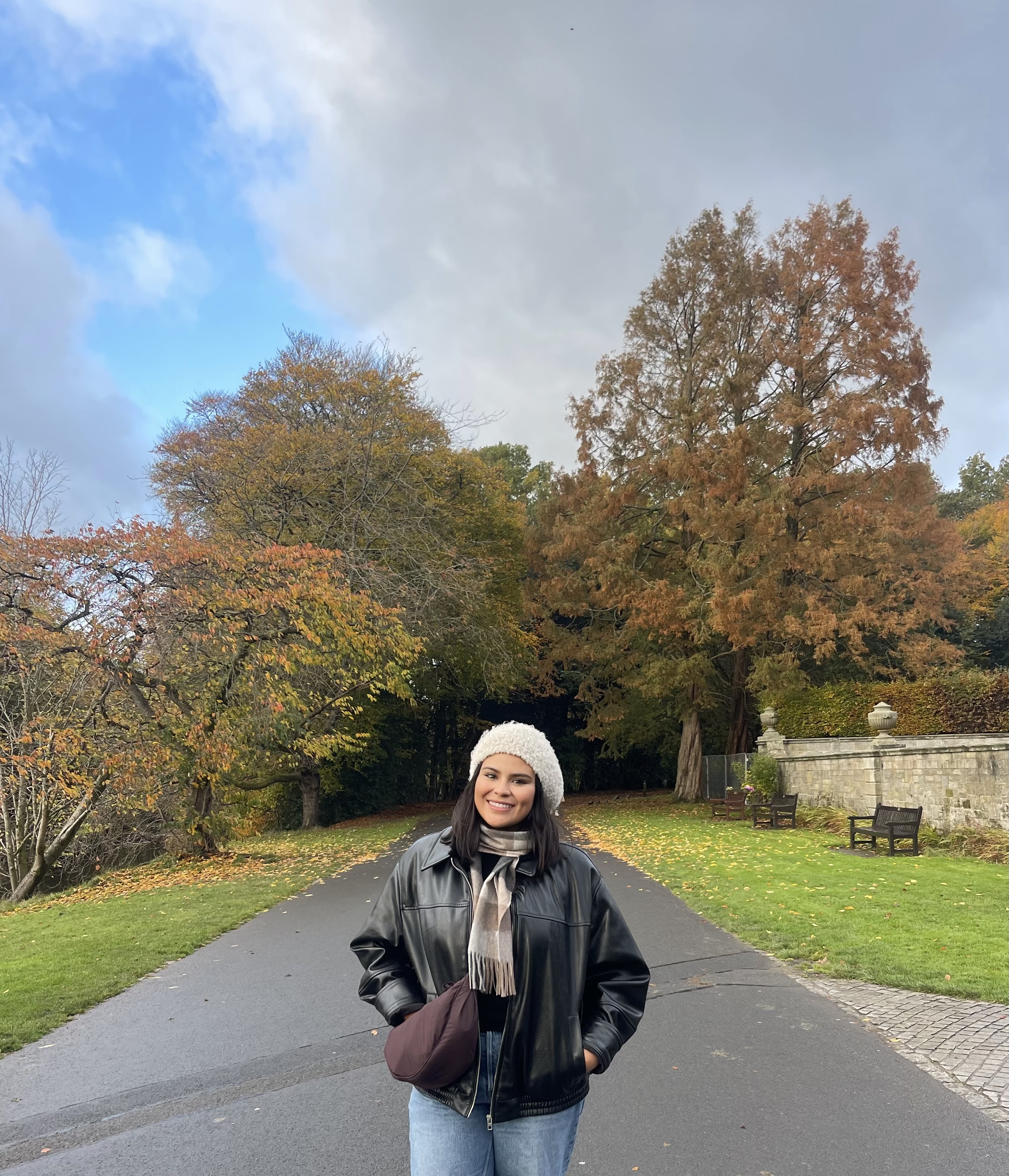 Student Bethany is standing in front of a tunnel of trees.