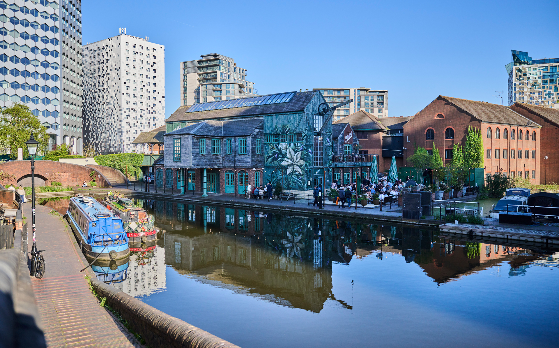 Birmingham's Gas Street basin with canal barges in the foreground and The Canal House in the background