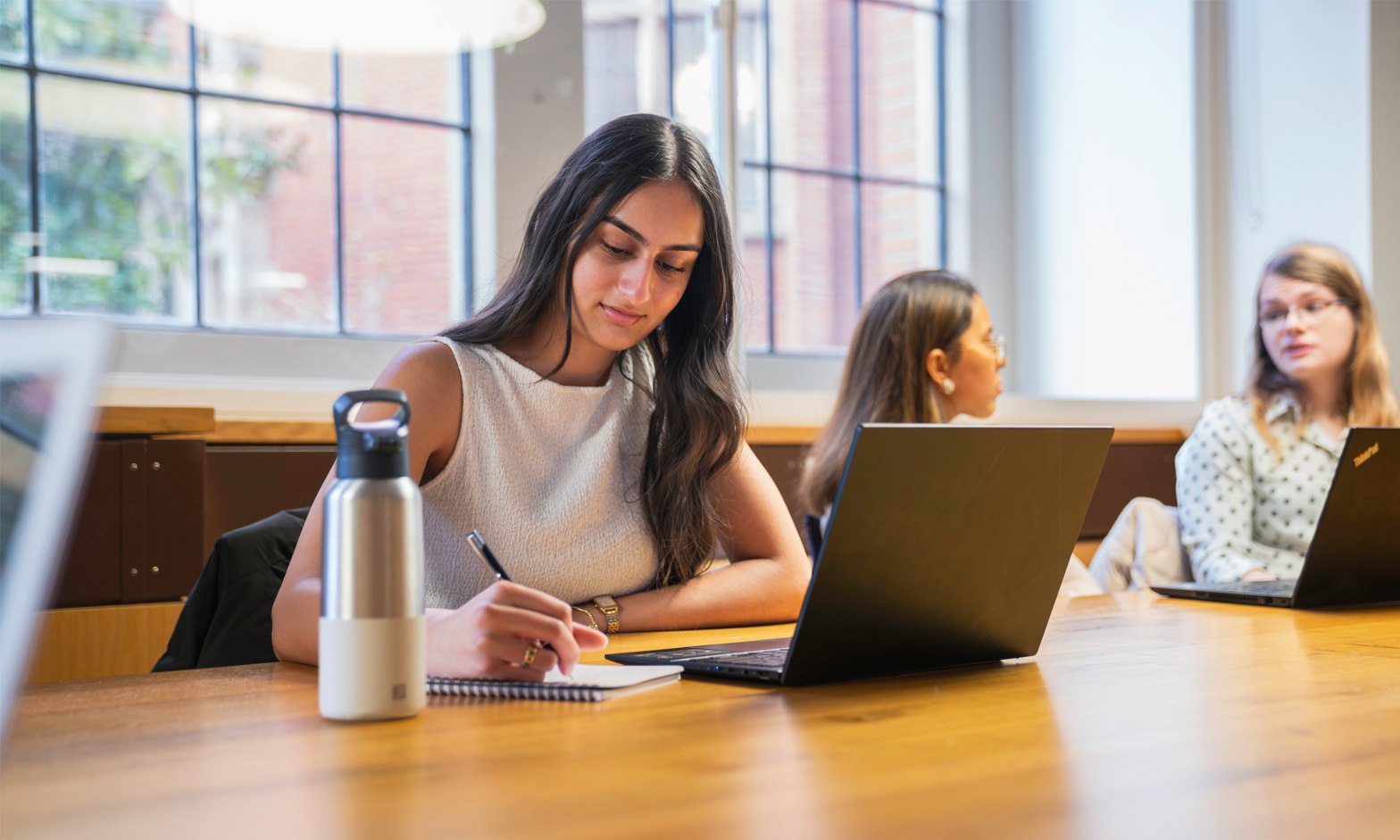 A female student working on a laptop