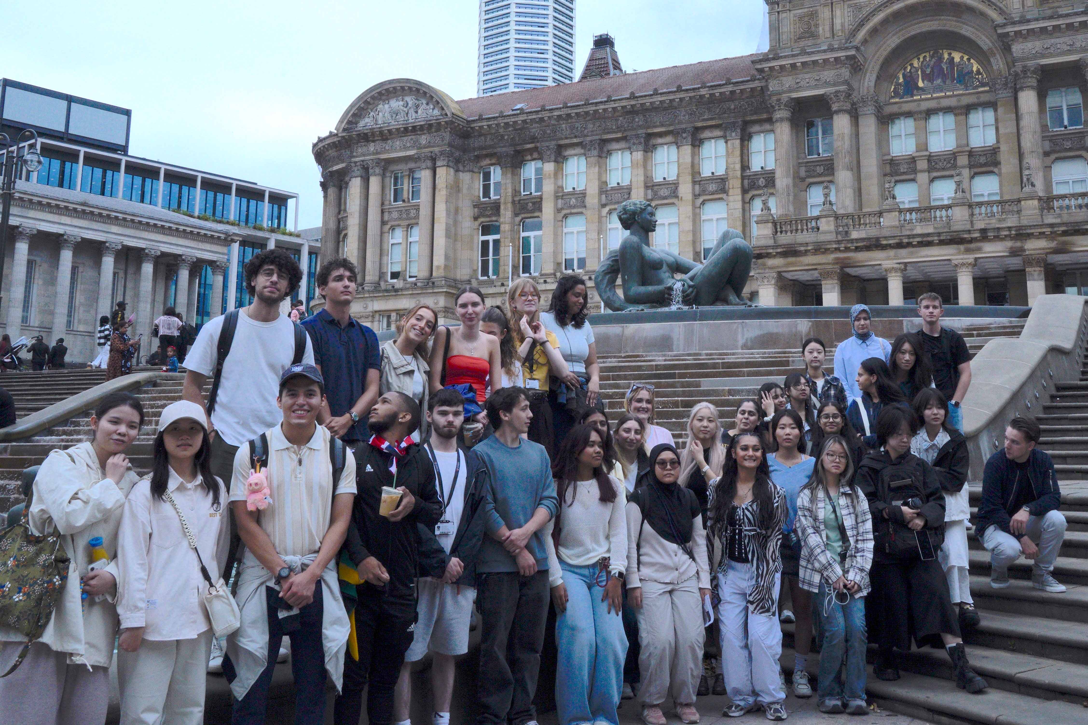 Summer school students in front of the fountain 